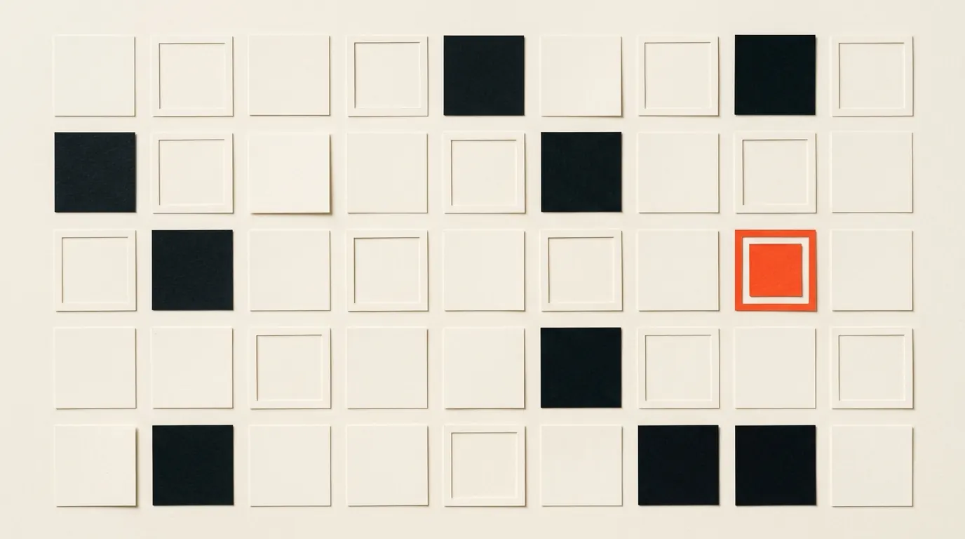 Cut-paper illustration: a grid of blank paper squares, some outlined with thin paper frames like labelling boxes, in black and off-white with one red-orange accent
