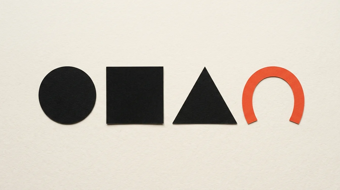 Cut-paper illustration: a row of simple geometric marks cut from paper, circle, square, triangle and an arc, in black and off-white with one red-orange accent